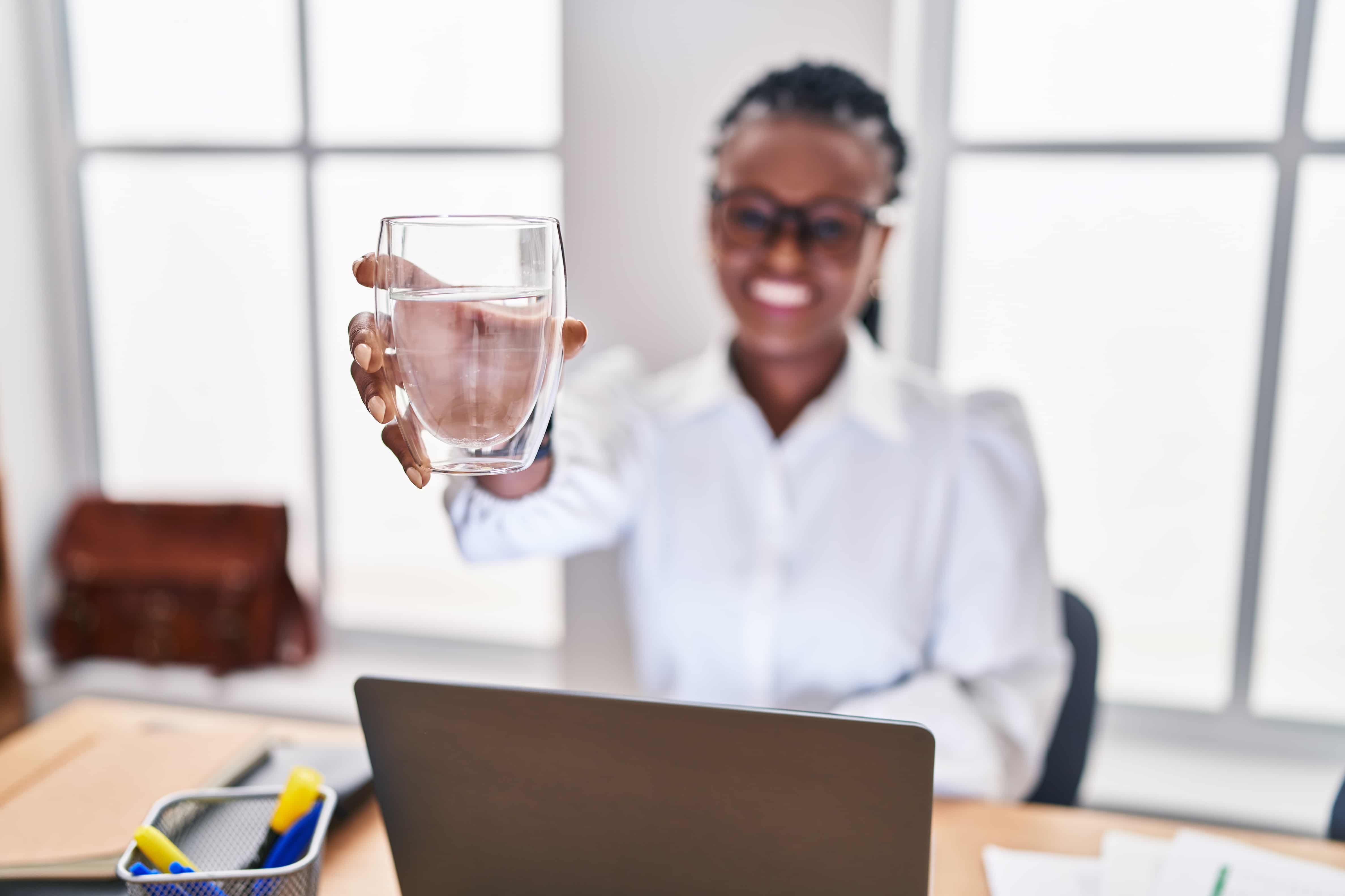 Fresh Drops bottled water being poured into a glass